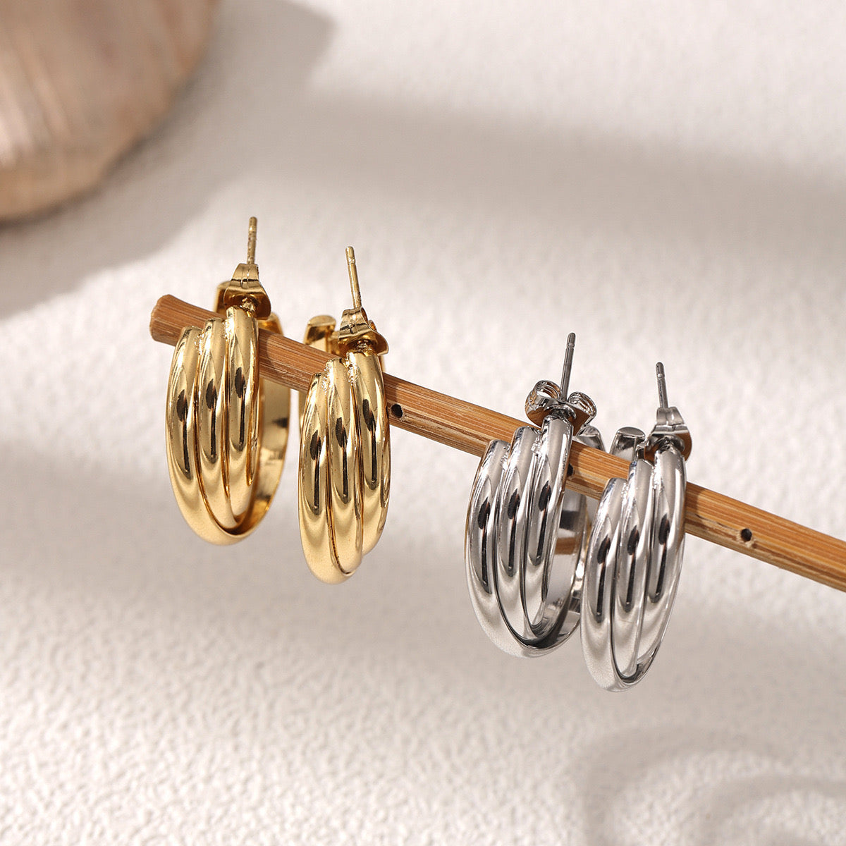 The trinity twist Hoops